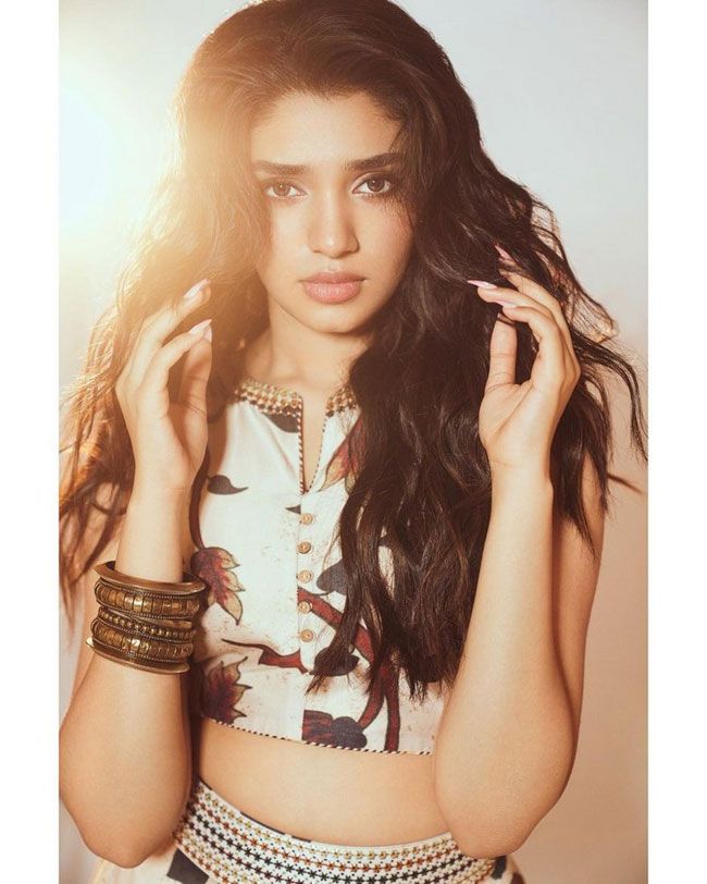 Krithi Shetty Staggering Poses In White Saree